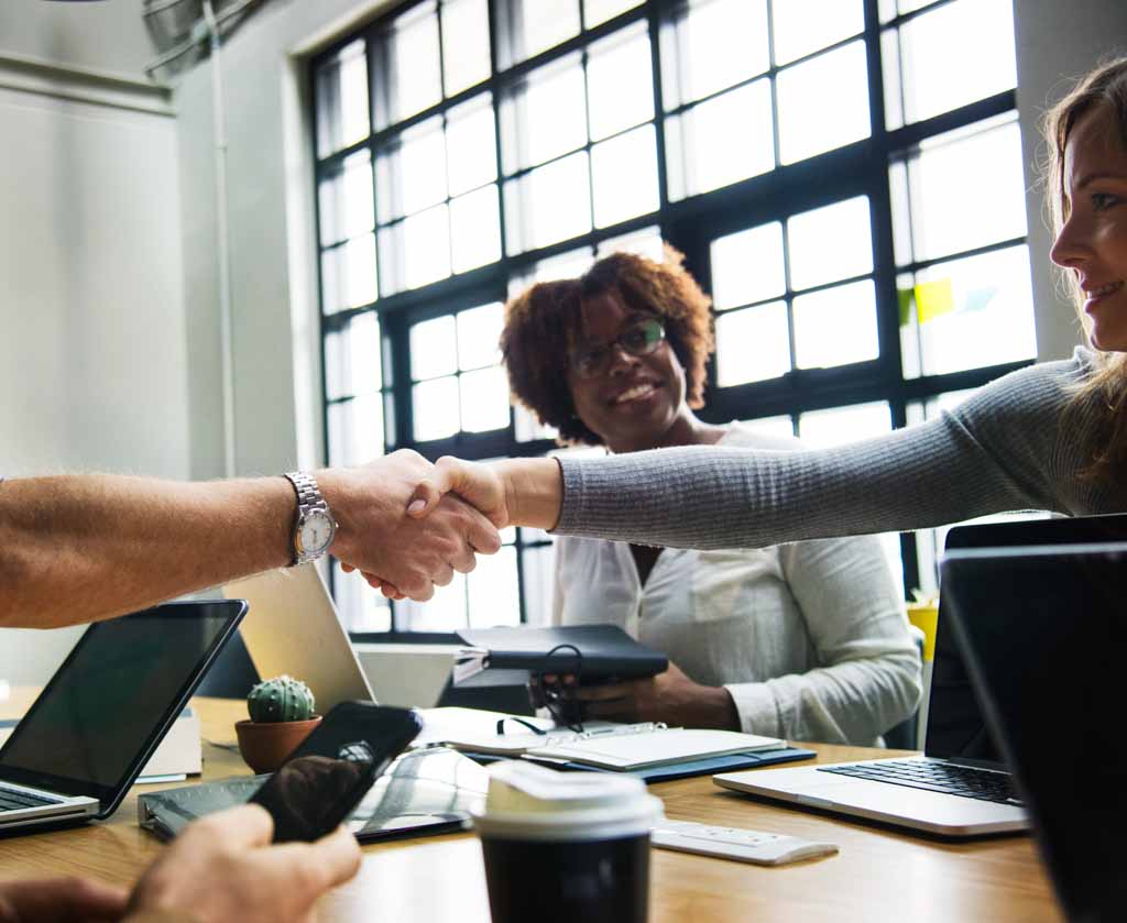 Scientists discussing a negotiation in a professional setting